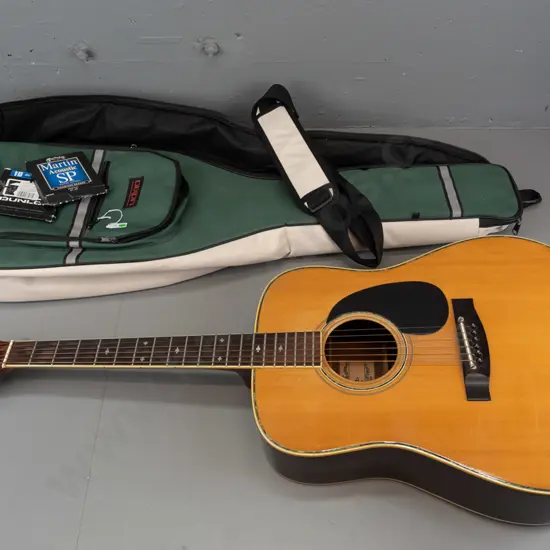 Fender F-65 dreadnought acoustic guitar, circa 1970s, with Dixon padded gig bag and some spare strings. Has some dents