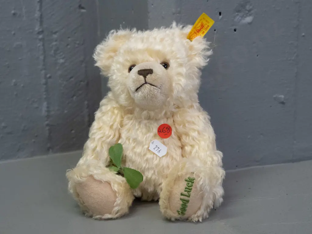 small Steiff lucky teddy bear - "Good Luck" embroidered in foot, 3-leaf clover attached to arm H-220 Image 1++