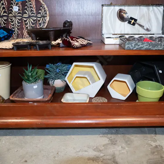 shelf of jardinieres, wall pocket vases, flower frogs etc.