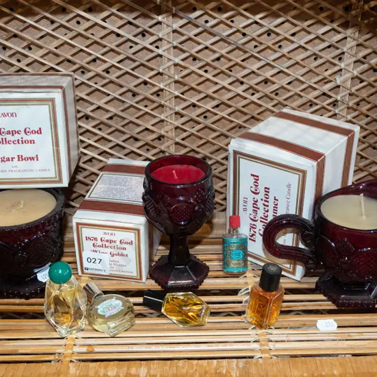 assorted candles and ruby glass vessels, miniature perfumes