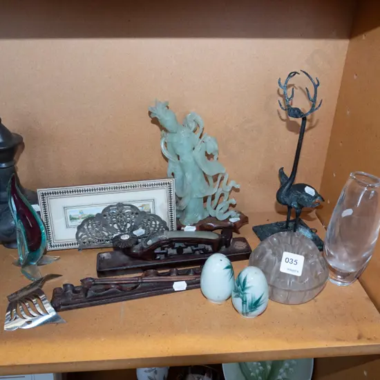 shelf of figurines, small print, letter rack, incense burner, vase, etc.