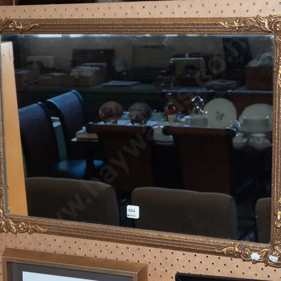 gilt-framed wall mirror 