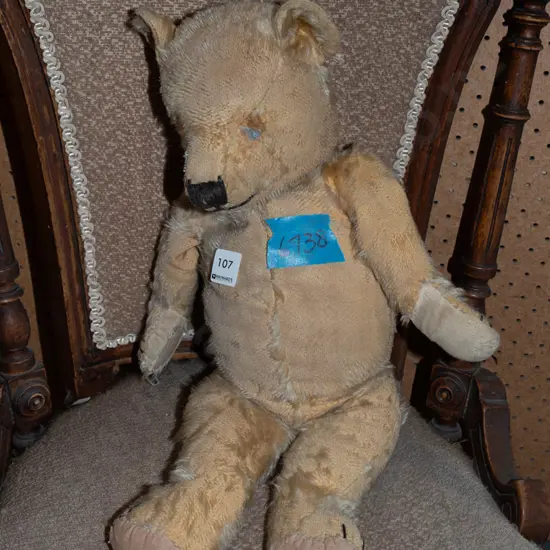 very worn old teddy bear