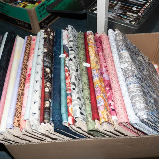 box of fabric pieces