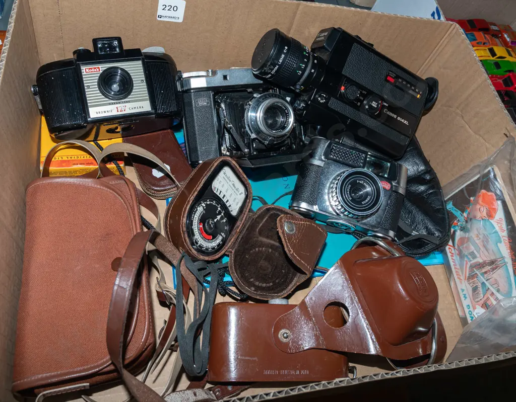 box; Zeiss Super Ikonta and other vintage film cameras, Canon 8mm cine camera, light meter etc Image 1++