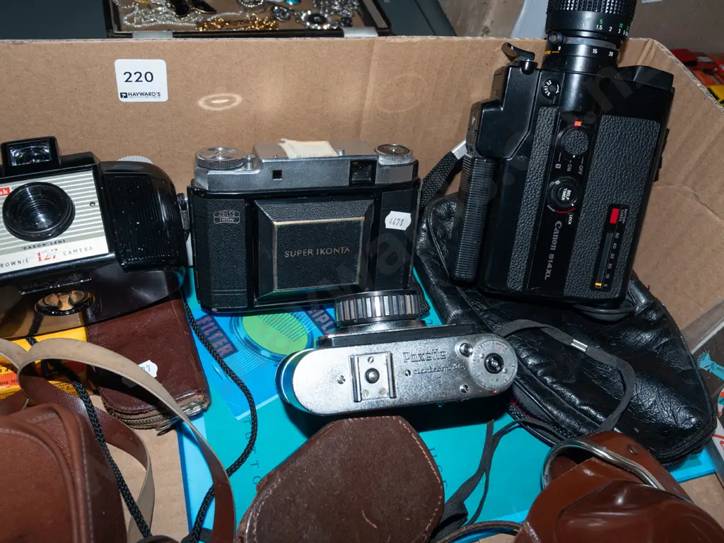 box; Zeiss Super Ikonta and other vintage film cameras, Canon 8mm cine camera, light meter etc Image 1++