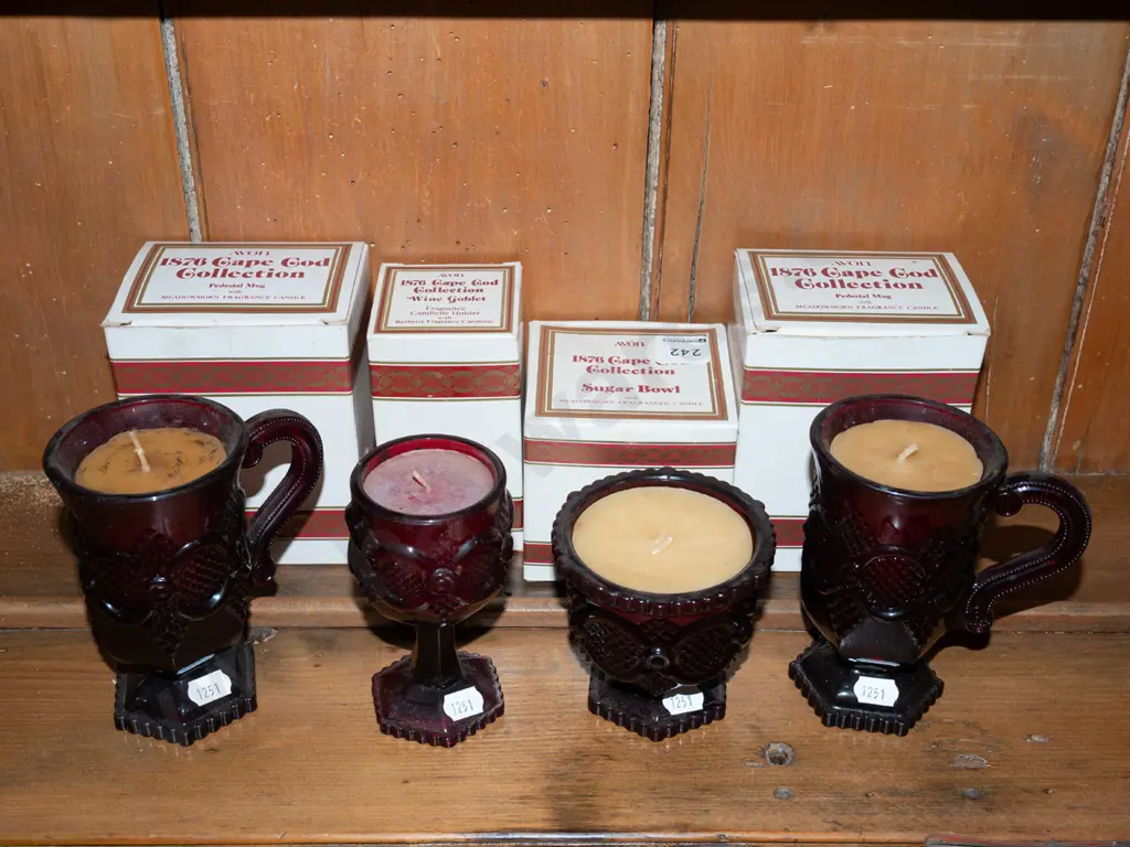 assorted candles and ruby glass vessels Image 1++