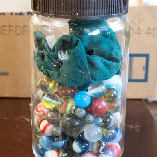 jar of various marble, marble bag