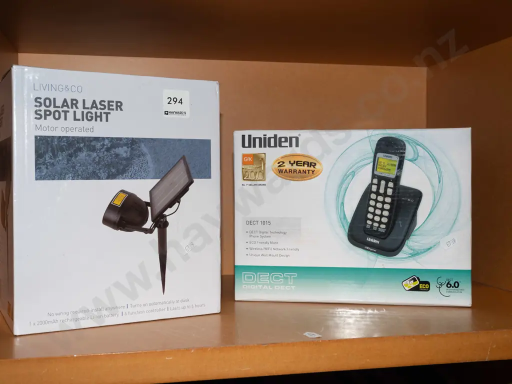boxed Solar Laser spotlight, Uniden cordless phone Image 1++