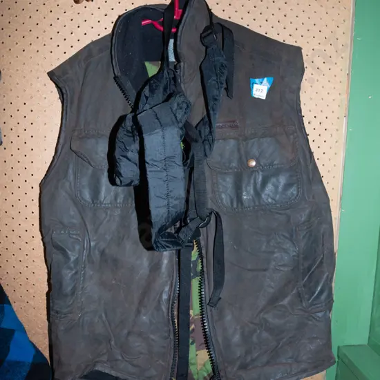 Stockmen oil skin vest, camouflage pouch, foldaway backpack