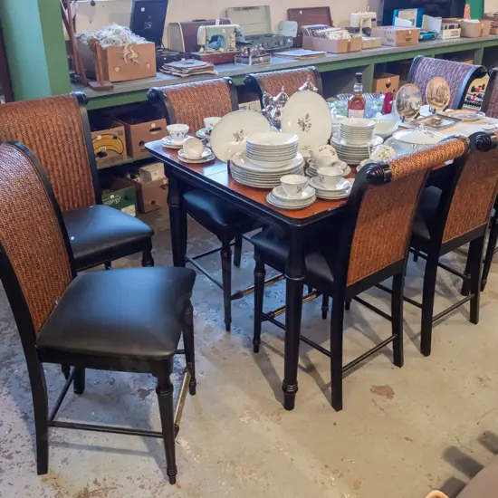 large American extending dining table with 8x matching high legged wood and woven cane chairs