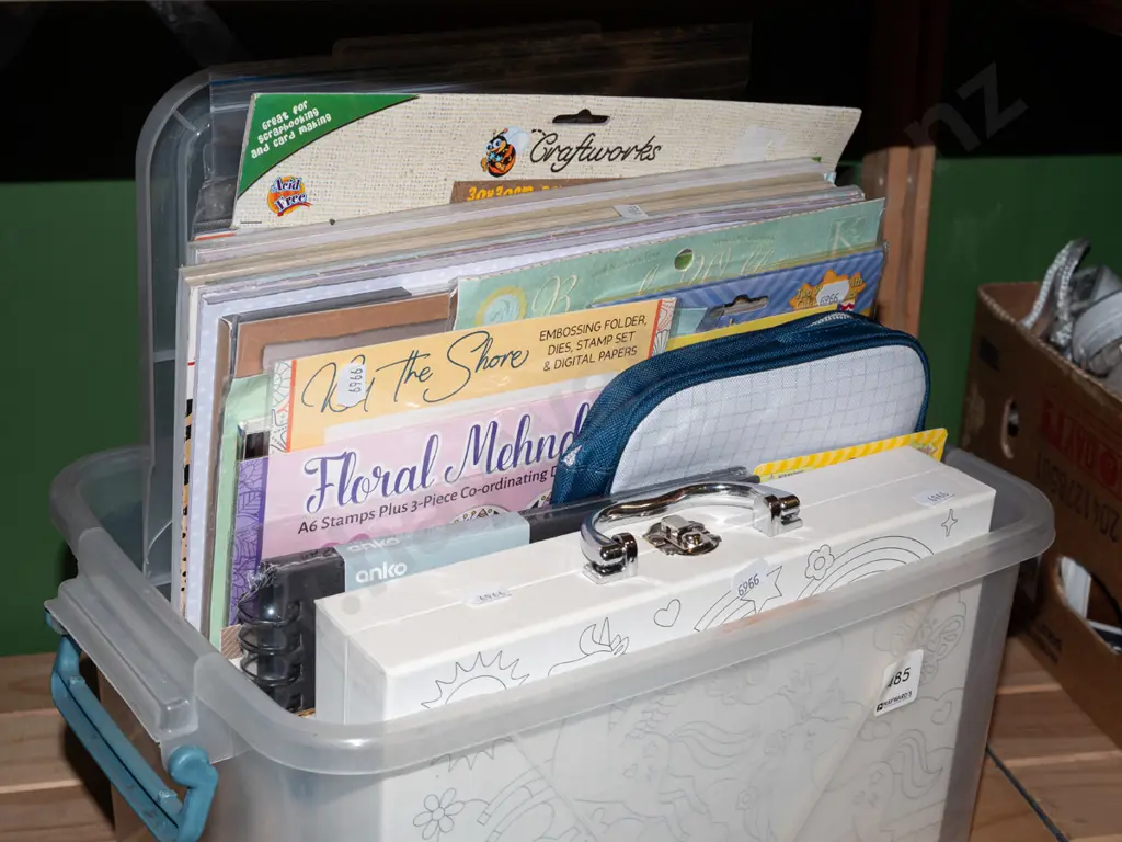plastic tub of crafting supplies, embroidery books, sparkle sheet, cards  etc Image 1++
