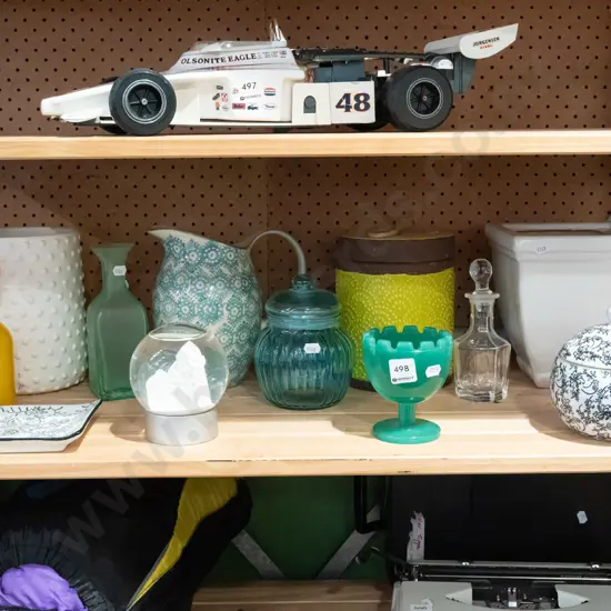 shelf; lidded canister, stoppered bottles, jugs etc