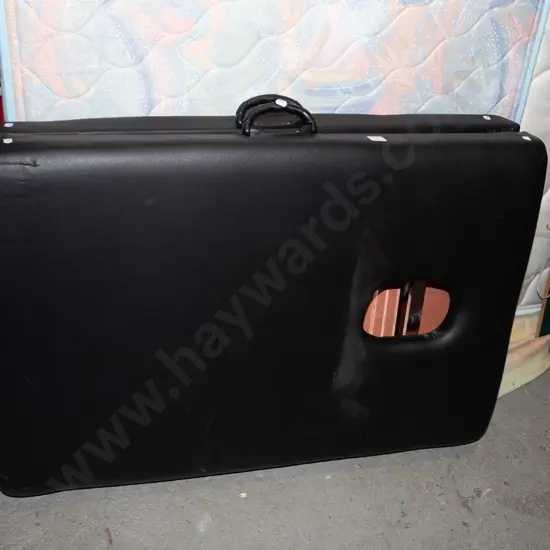 black vinyl massage table