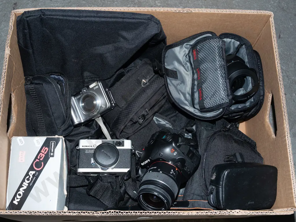 box; Sony digital camera, Konica 35mm camera, small Canon digital camera etc Image 1++