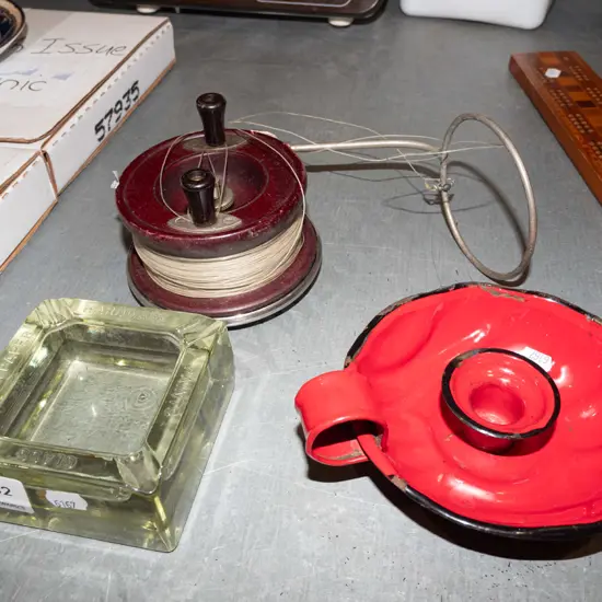 ashtray, chamber stick, fishing reel