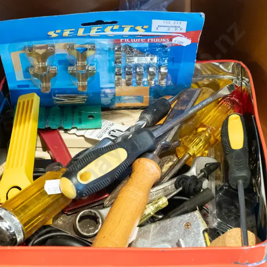 tin of various hand tools and picture hooks
