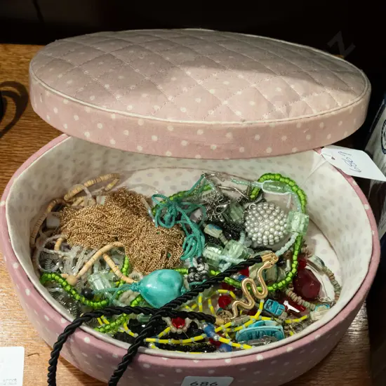 fabric upholstered container and costume jewellery