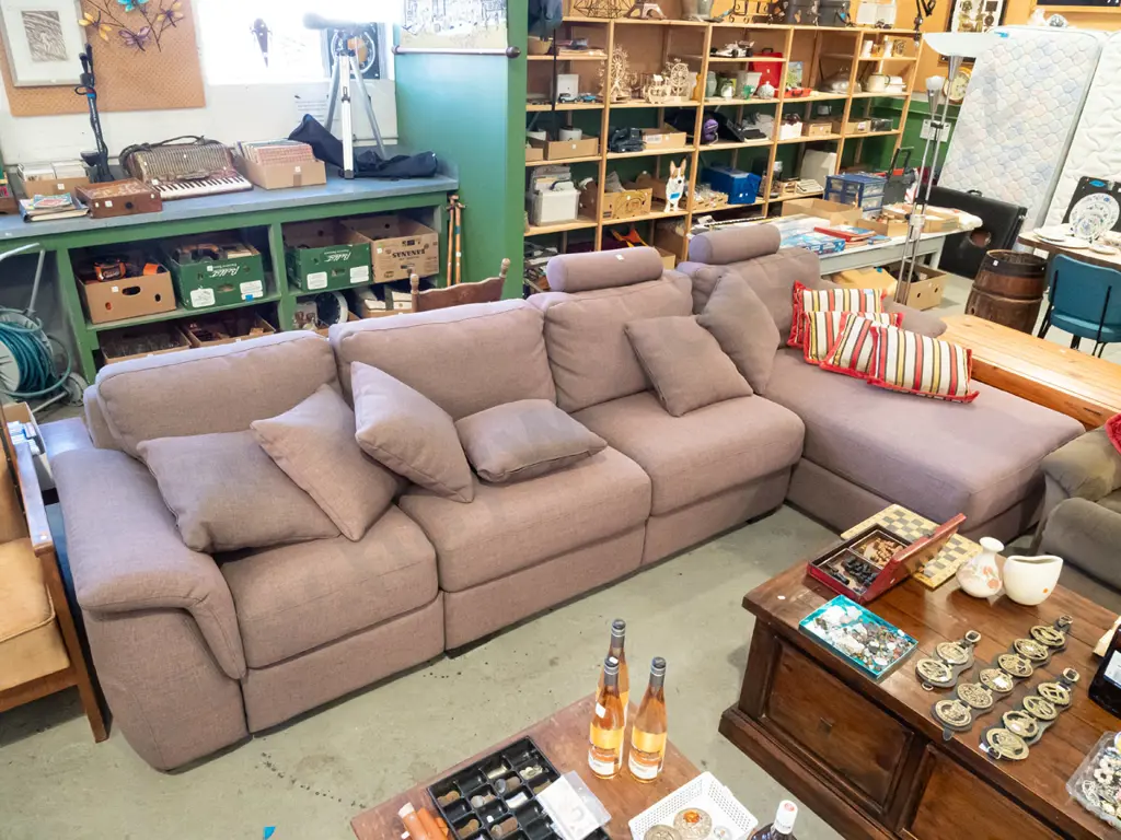 large brown upholstered corner lounge suite with removable head rests and matching cushions - significant fading Image 1++