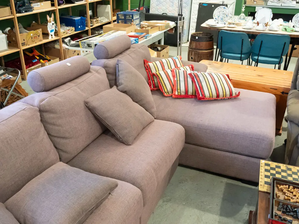 large brown upholstered corner lounge suite with removable head rests and matching cushions - significant fading Image 1++