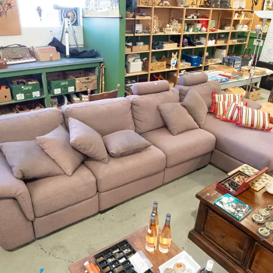 large brown upholstered corner lounge suite with removable head rests and matching cushions - significant fading