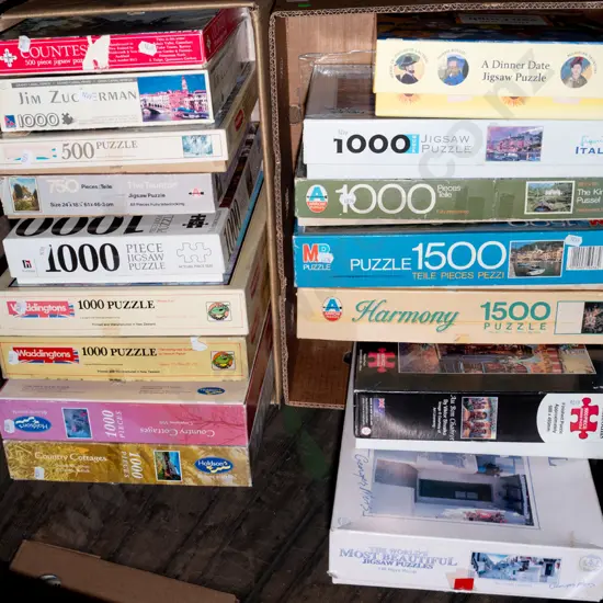 2x boxes of puzzles - green dots
