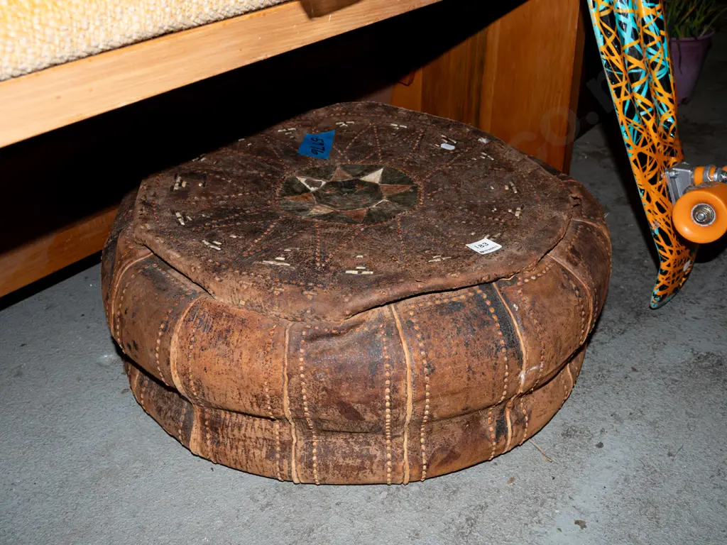 hand worked; leather pouffe - rips and wear Image 1++