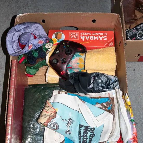 box; tea towels,small  tarpaulin, x-box controller etc