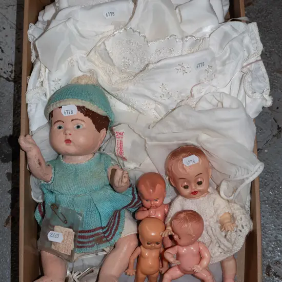 box of dolls and clothes