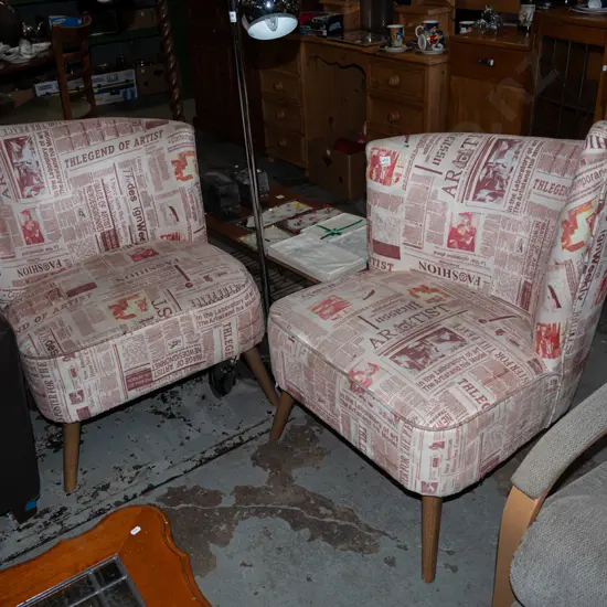 pair of asymetrical post modern chairs with art newspaper print - stains to fabric 
