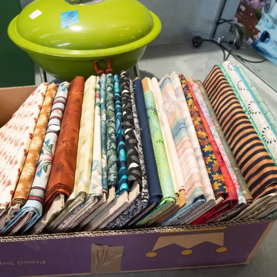 box of fabric pieces