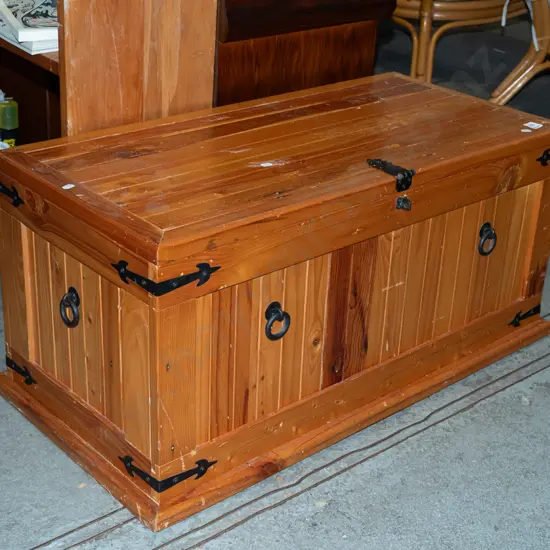 small pine blanket box with metal bracings 
