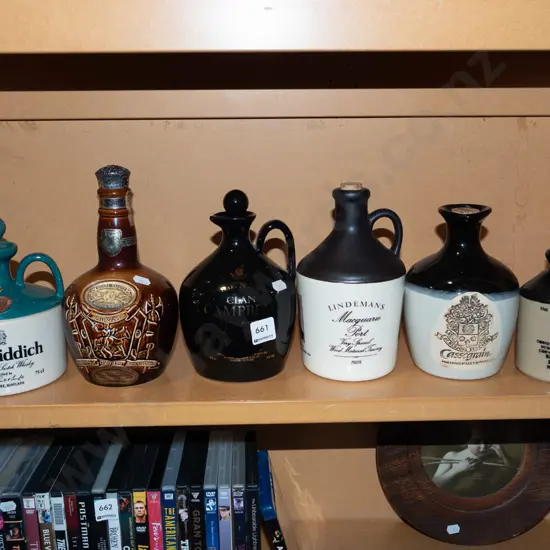 shelf of whisky bottles/jugs