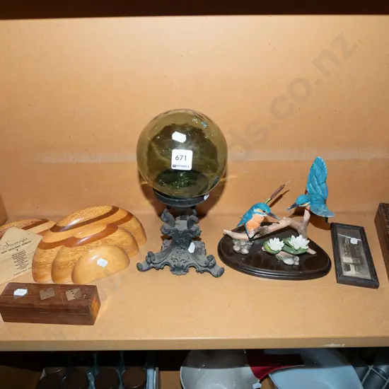 shelf; green glass ball on cast iron stand, bookends, bird figurine etc