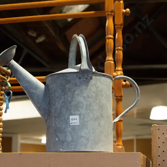 galvanised watering can