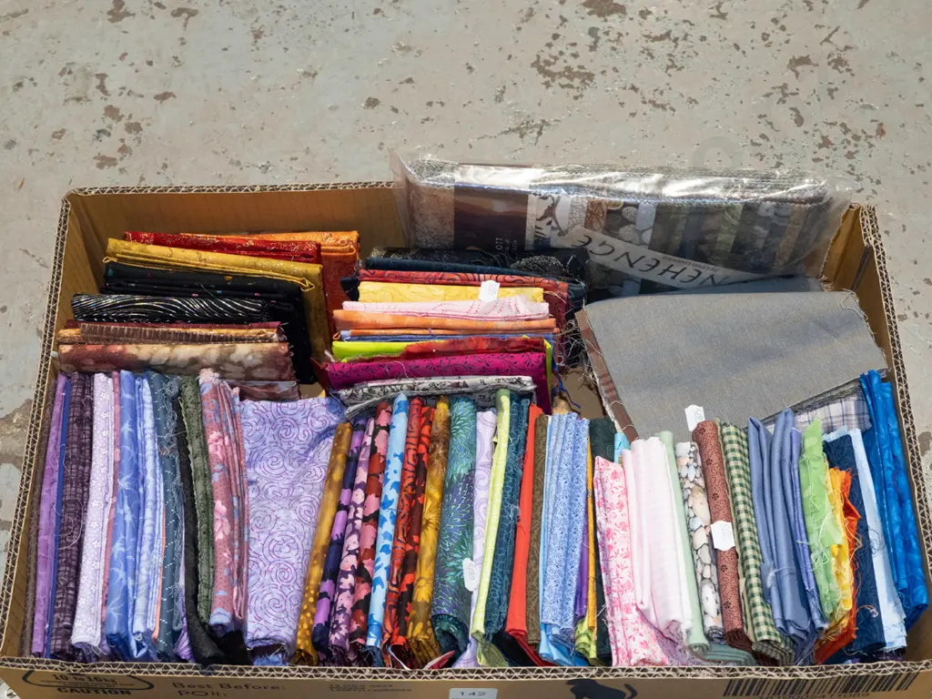 box of fabric pieces Image 1++