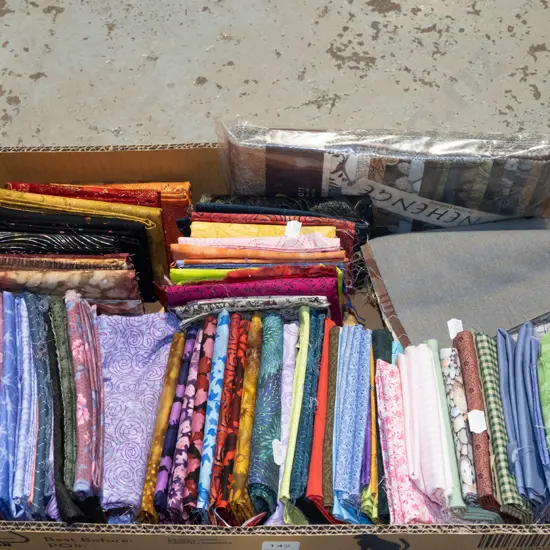 box of fabric pieces