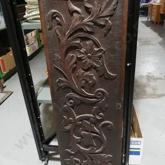 heavily carved wooden panel possibly from drop front desk W1000