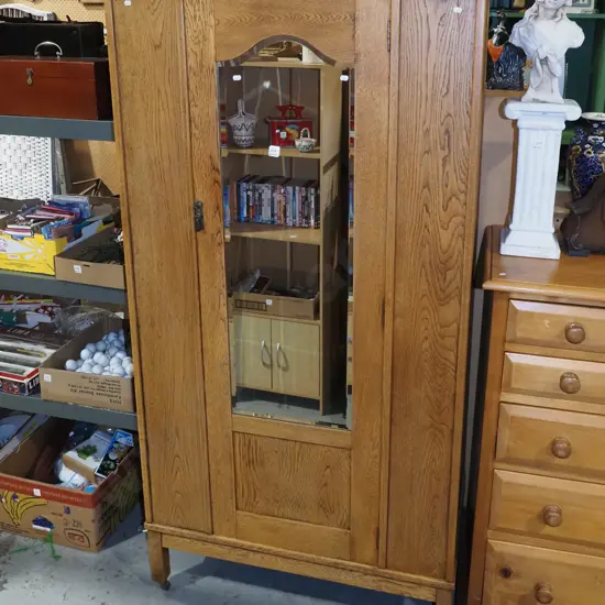 oak single door wardobe on casters with bevelled edge mirror H1870 W945 D510