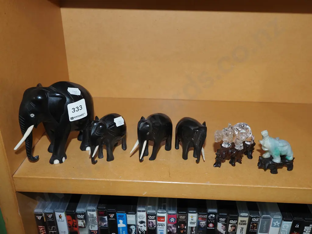 shelf of elephant figurines Image 1++