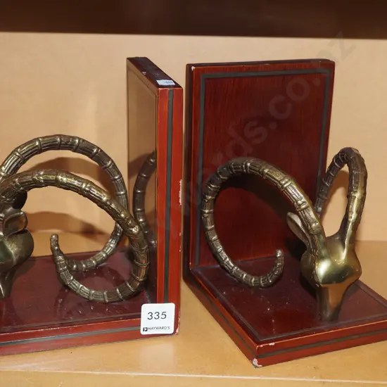 wood and brass goat themed bookends