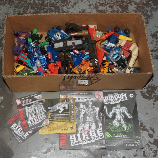 box of plastic toys