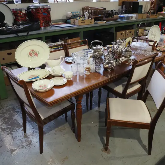 mahogany extending dining table with 6 matching chairs- some fading to table top