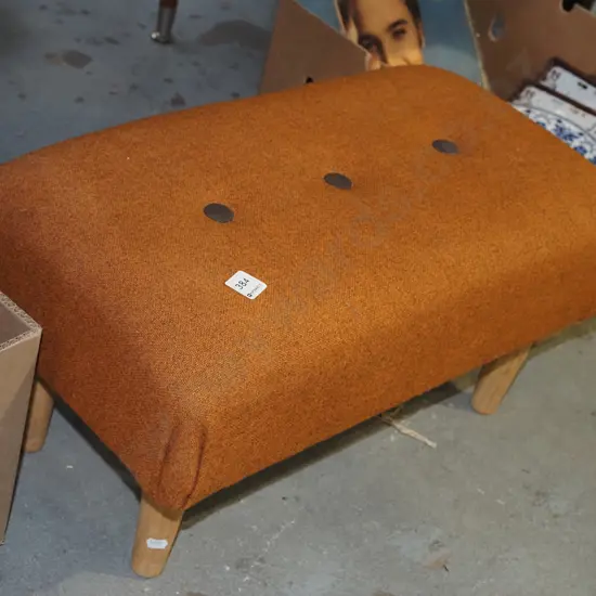 orange deep buttoned footstool