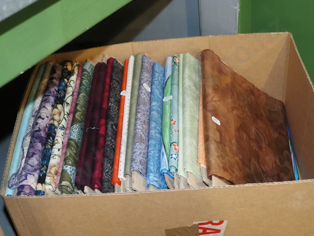 box of fabric pieces Image 1++
