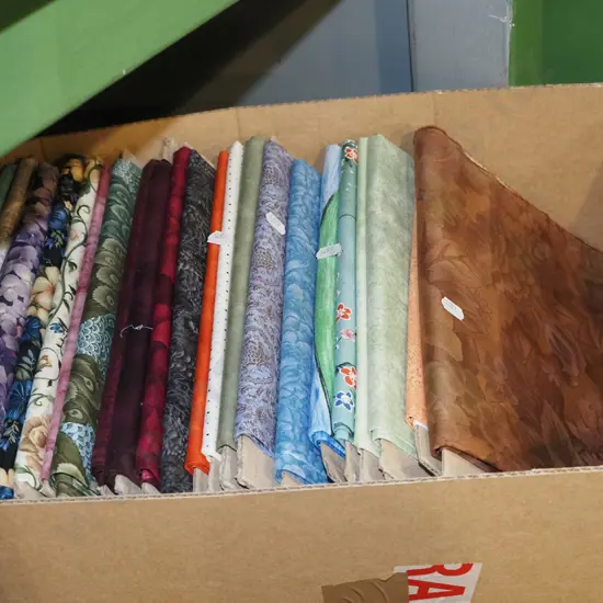 box of fabric pieces