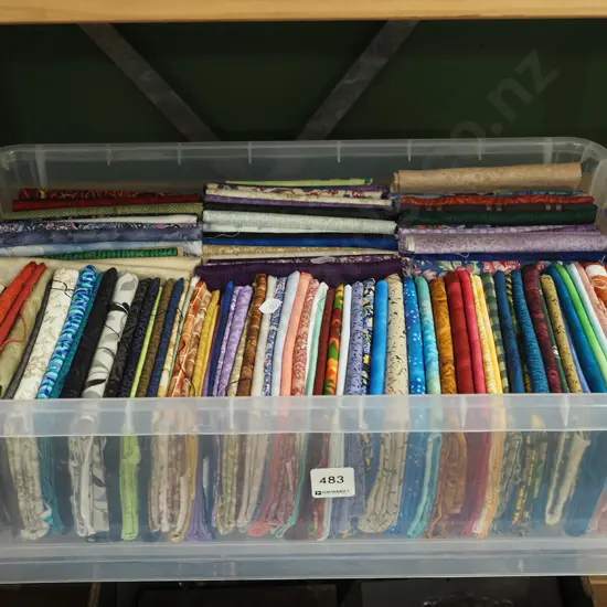 fabric pieces in lidded container