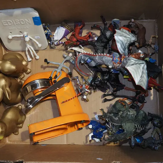 box; figurines, orange squeezer, plastic rabbits etc