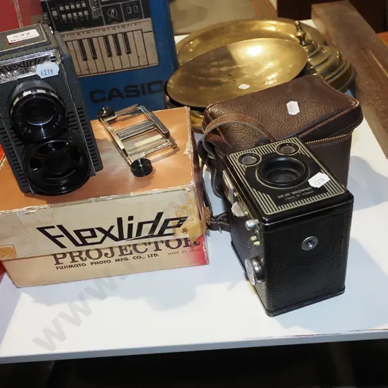 Flexlide 35mm slide projector (cord has been cut) and Kodak Six-20 Brownie box camera