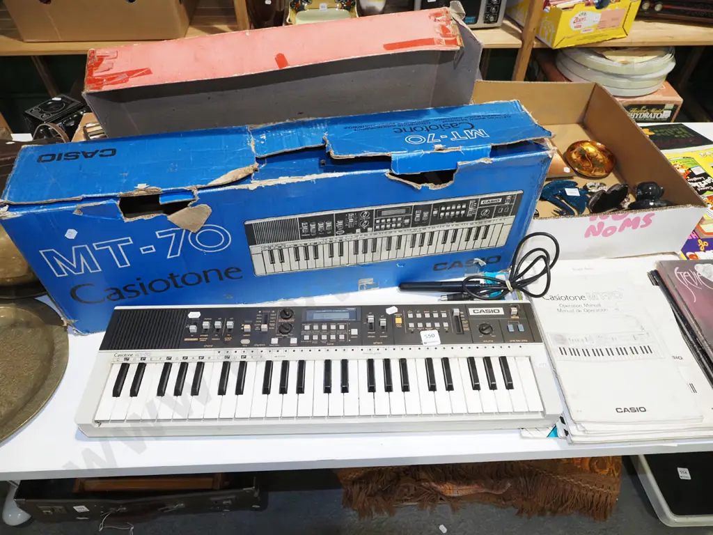 Casio MT-70 keyboard with bar code reader, music sheets and manual - AS IS - NO RETURNS - no power cord, some notes Image 1++